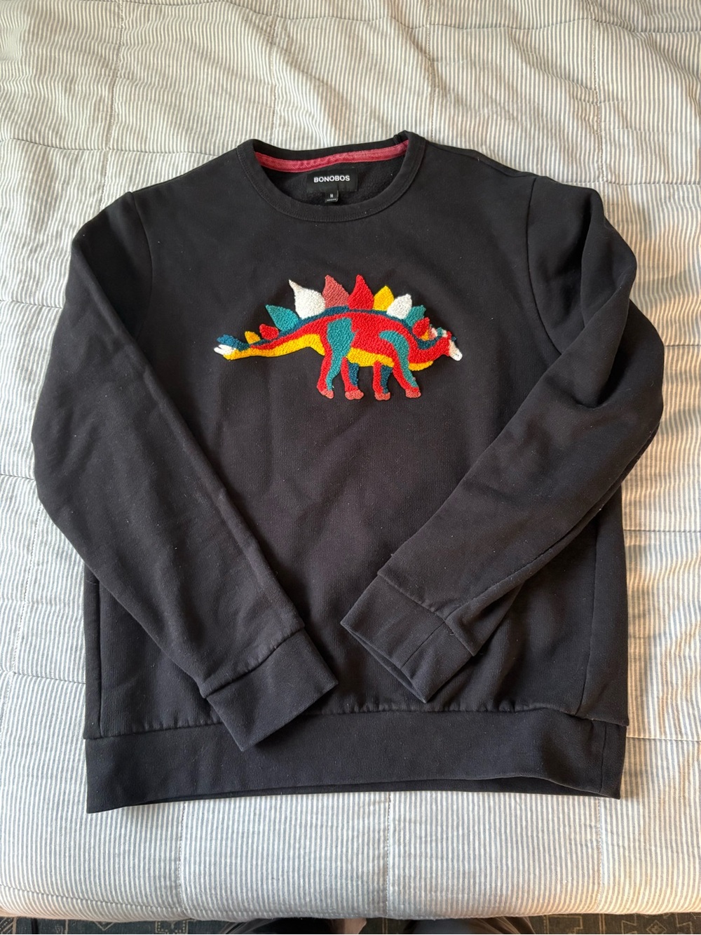 Bonobos Black Crewneck Sweater with Red, Teal, Yellow & White Stegosaurus